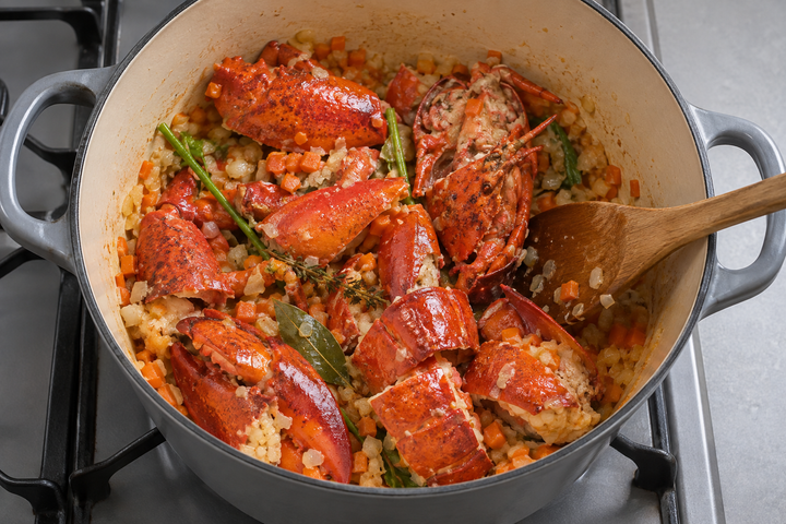 Sauté aromatics and lobster in butter until the shells turn red