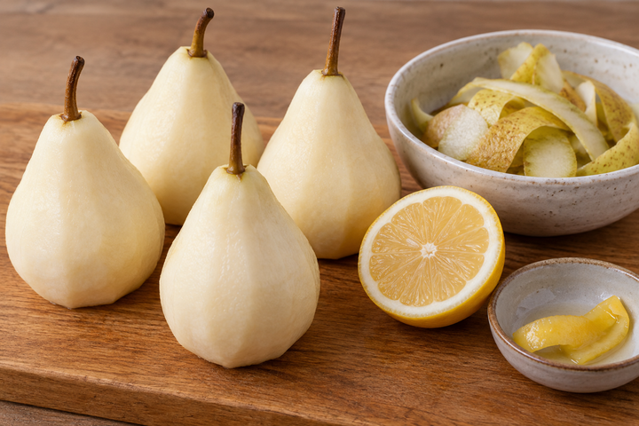 Peel the pears with stems intact and blanch the lemon peel