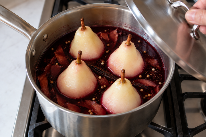 Add the pears stem-side up and poach covered over low heat for 20 minutes