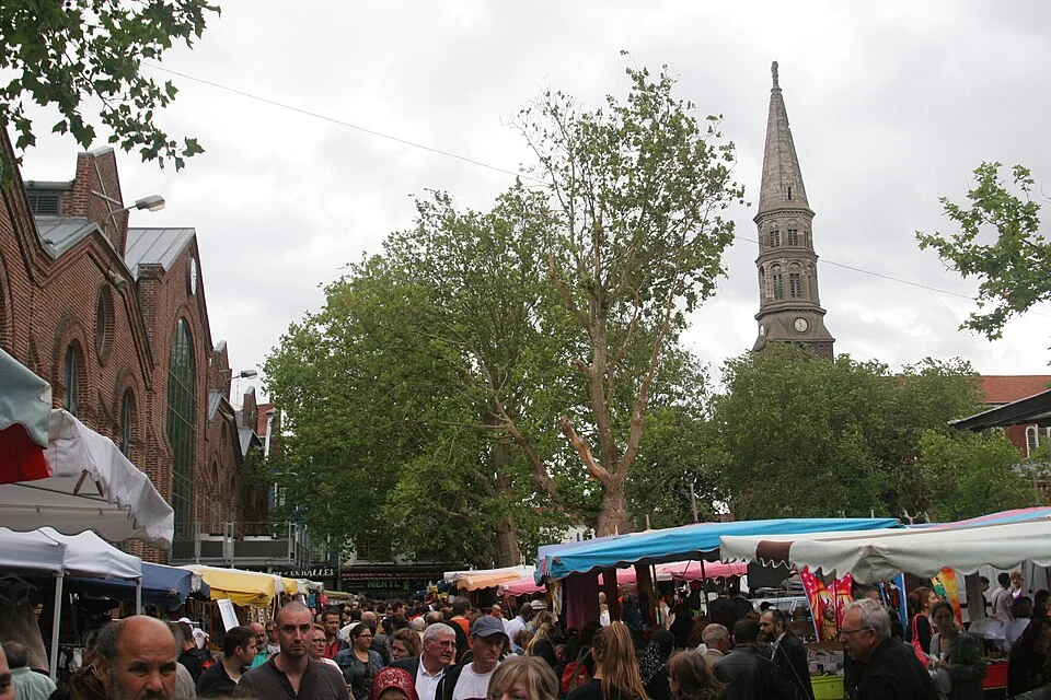Market stalls and shoppers at Wazemmes in Lille
